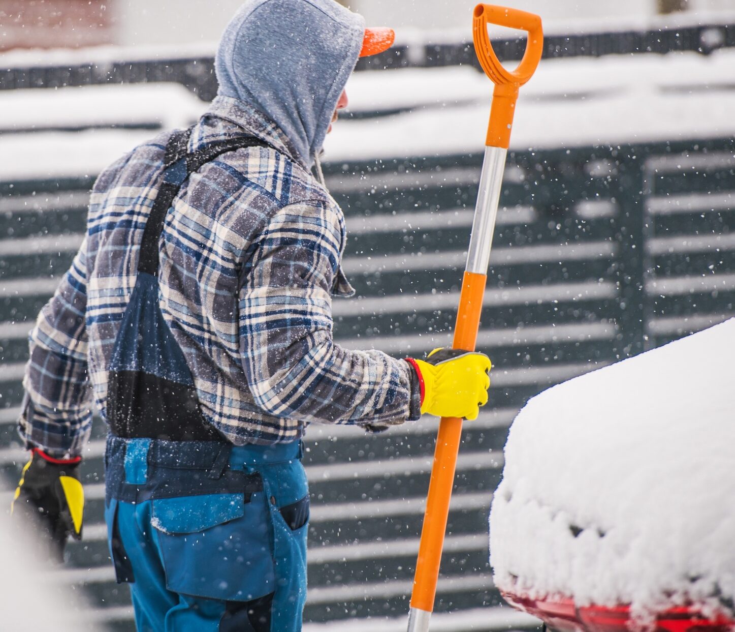 Men Removing Snow During Heavy Snow Fall